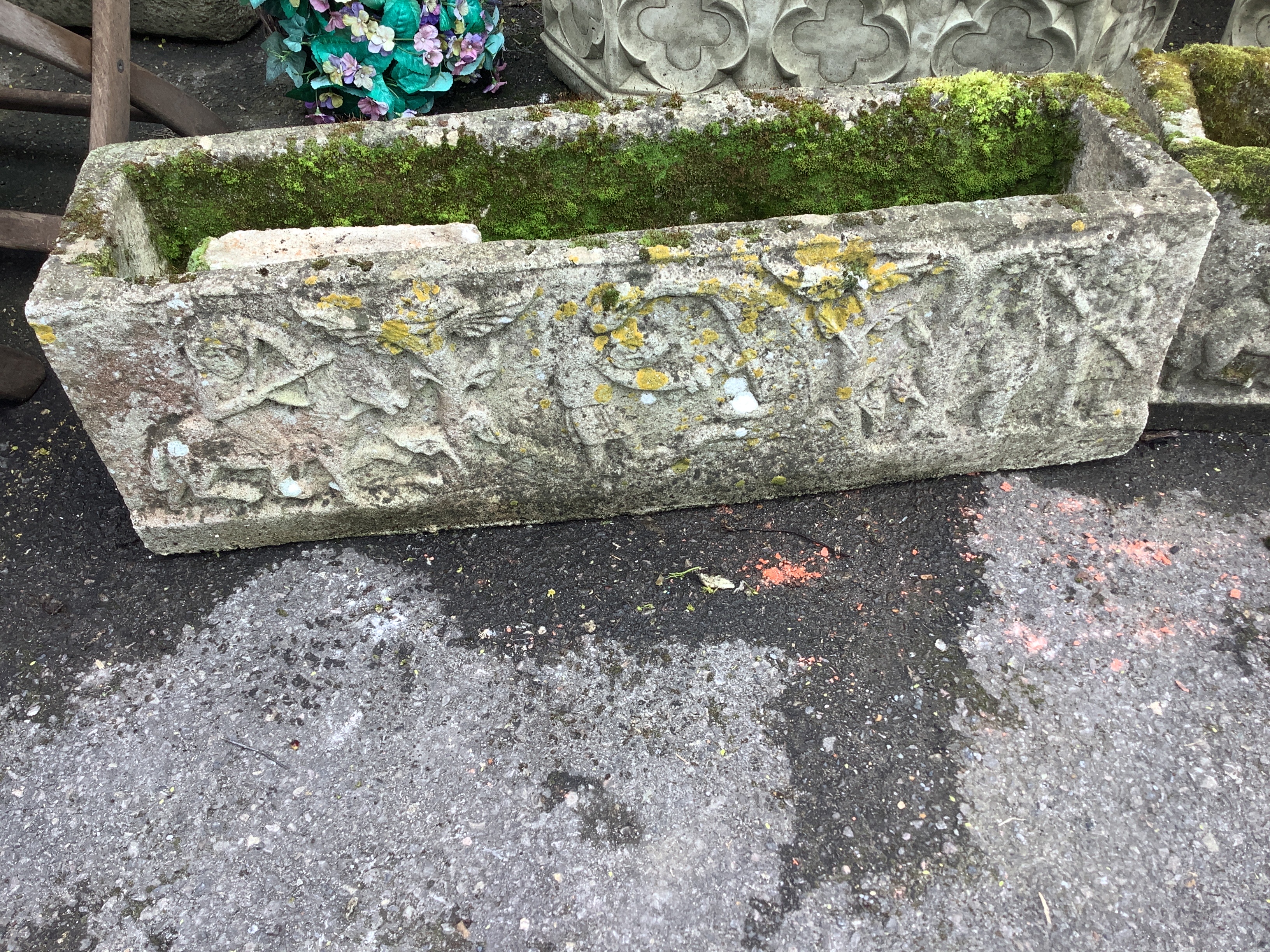 A pair of rectangular reconstituted stone garden trough planters, moulded with classical figures, width 98cm, depth 25cm, height 30cm